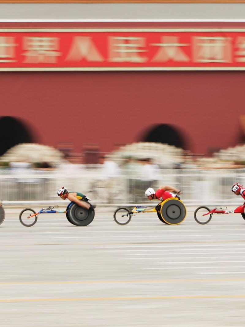 The lead group of the marathon goes past the Forbidden City at Tiananmen Square at the Beijing 2008 Paralympic Games.