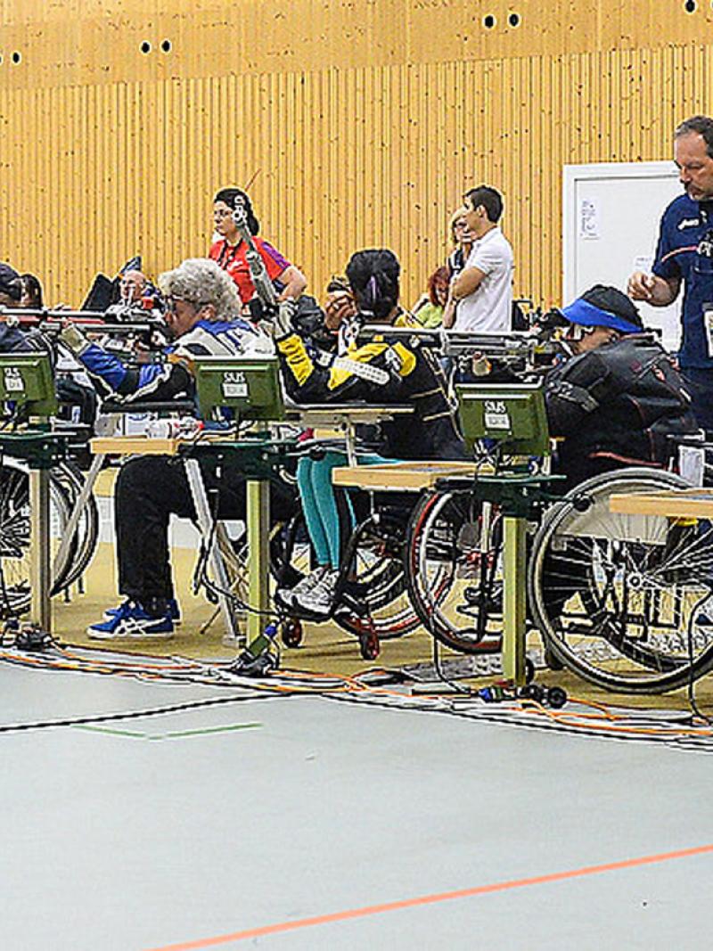 Shooters take aim during rifle competitions at the 2014 IPC Shooting World Championships