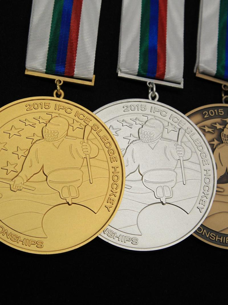 The gold, silver and bronze medal of the 2015 IPC Ice Sledge Hockey World Championships in Buffalo, USA.