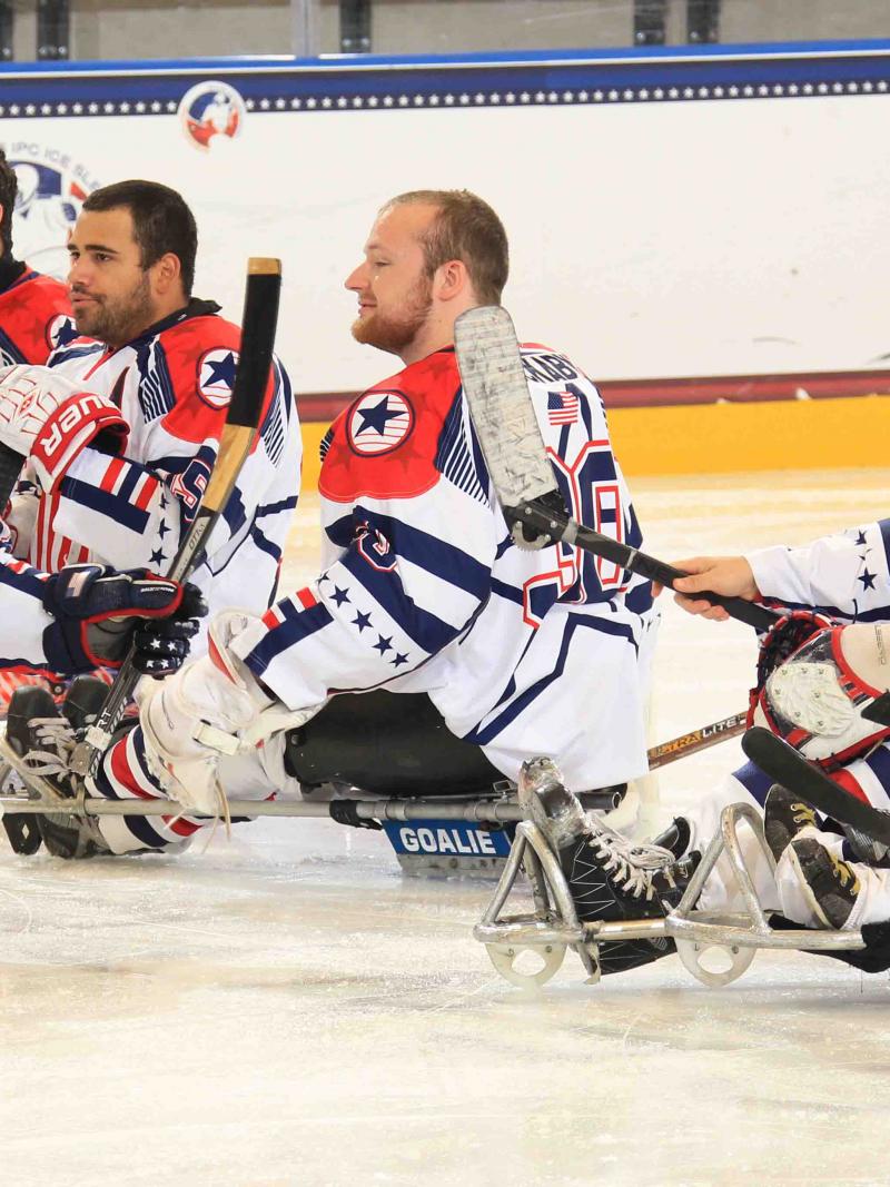 Group of ice sledge hockey players on the ice