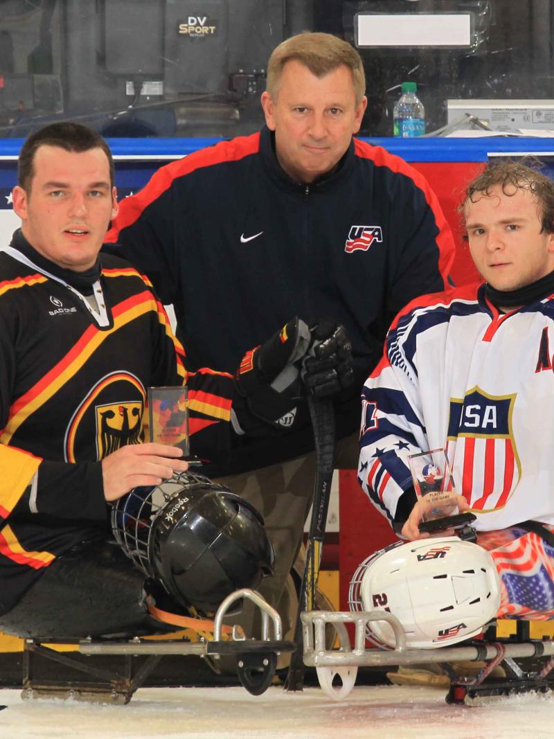 Best players of the preliminary game, Joshua Pauls, USA, and Bernhard Hering, Germany, at the 2015 IPC Ice Sledge Hockey World Championships A-Pool Buffalo.