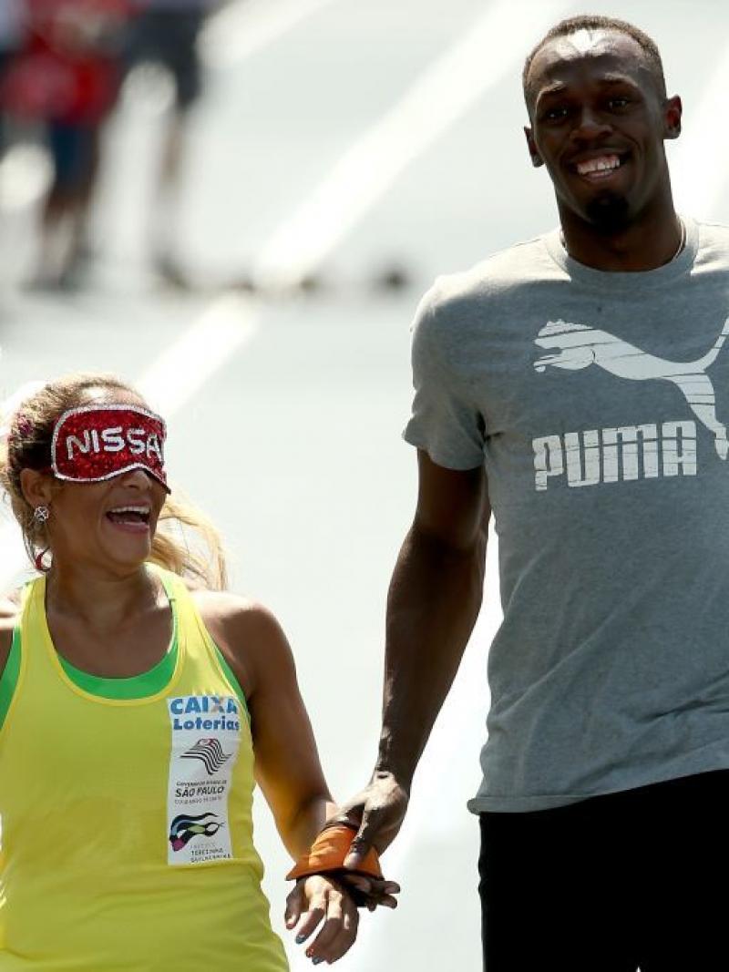 Paralympian Terezinha Guilhermina of Brazil runs with Usain Bolt of Jamaica as her guide during an exhibition in preparation for the Mano a Mano Athletics Challenge in Rio de Janeiro, Brazil. In 2011, she was elected to the APC Executive Committee at the Guadalajara Parapan American Games.