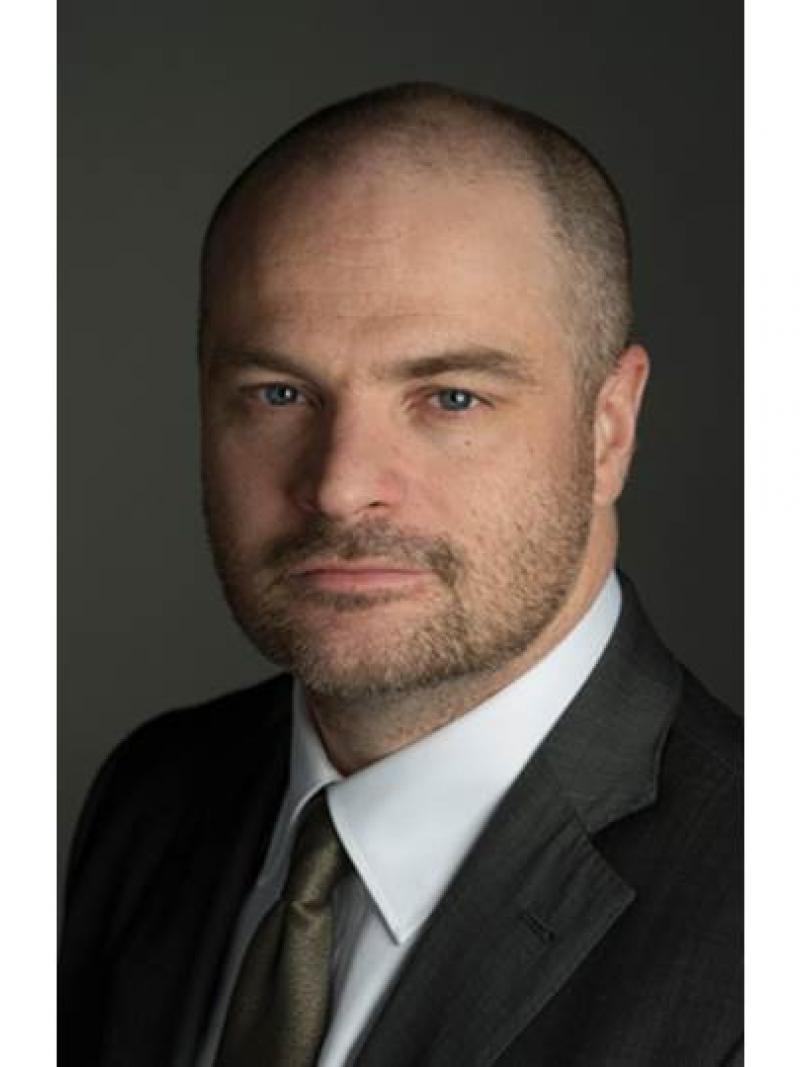 Portrait picture of a man with short hair