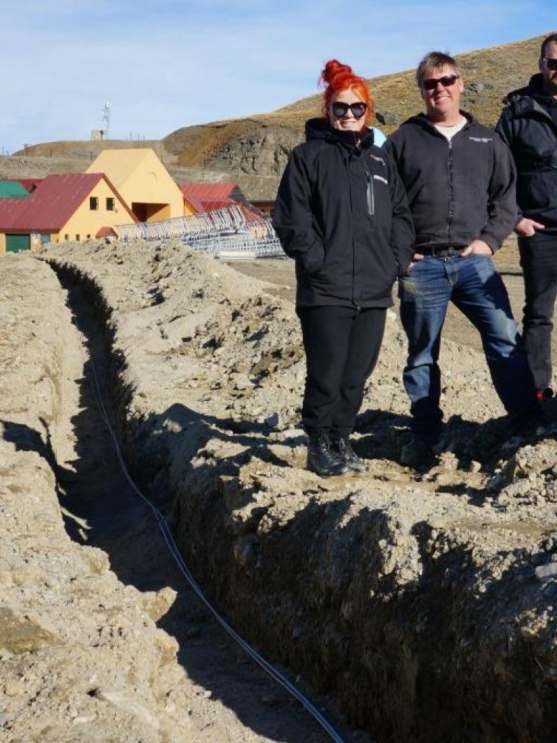 Cardrona general manager, Bridget Legnavsky and Cardrona terrain and snow manager, Dave Collett with Cameron Ross from High Performance Sport NZ and Audi quattro Winter Games NZ sports manager, Iona Bentley next to one of the fibre optic cable channels at Cardrona Alpine Resort