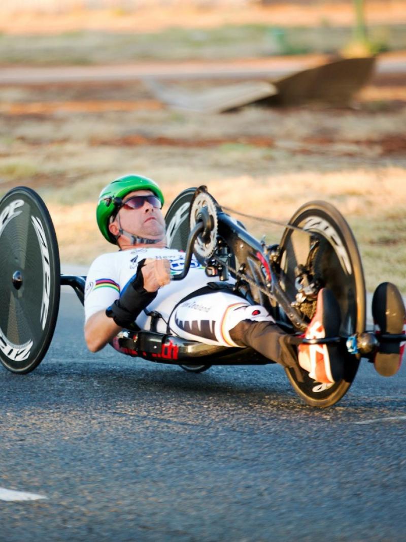 Man in a handbike on a road