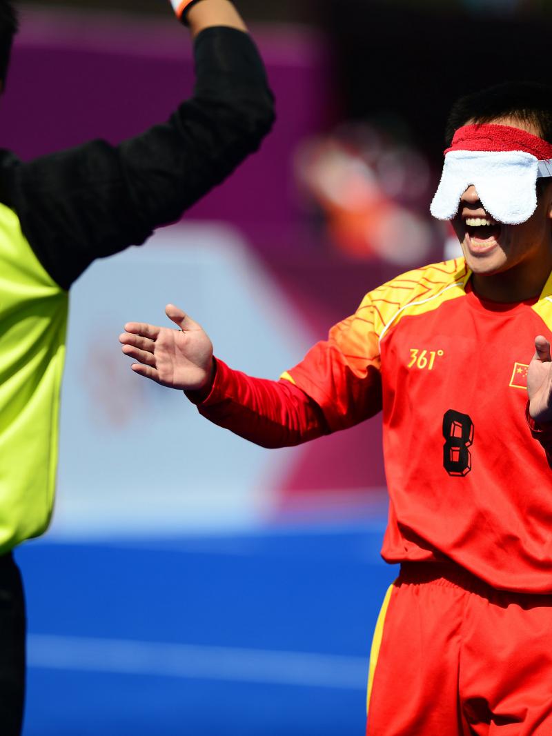 Blindfolded football player celebrates