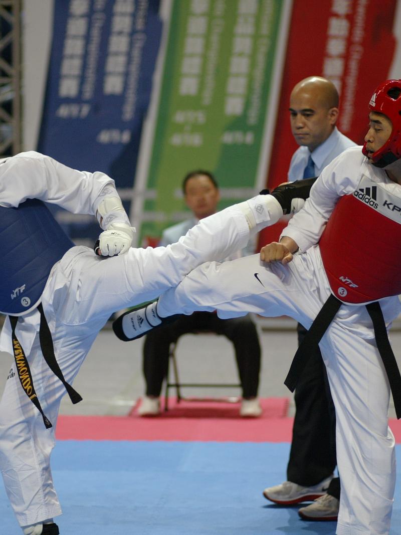 Two athletes performing in taekwondo