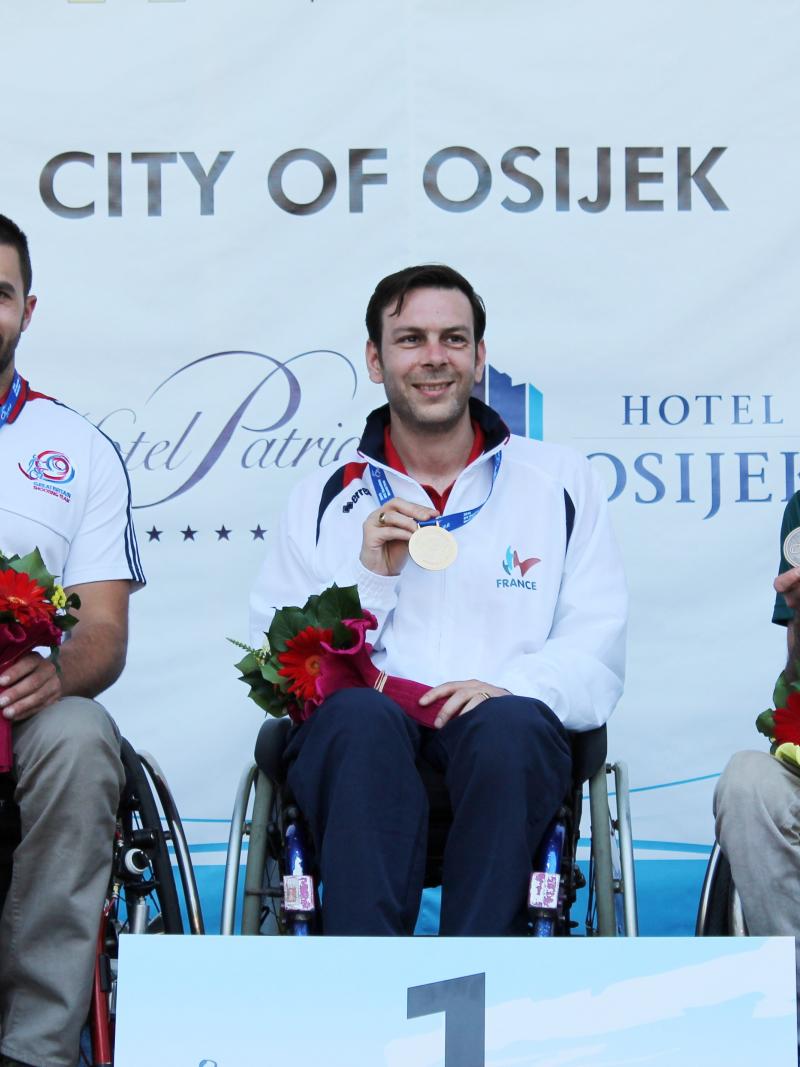 Three shooters display their medals at an IPC Shooting World Cup