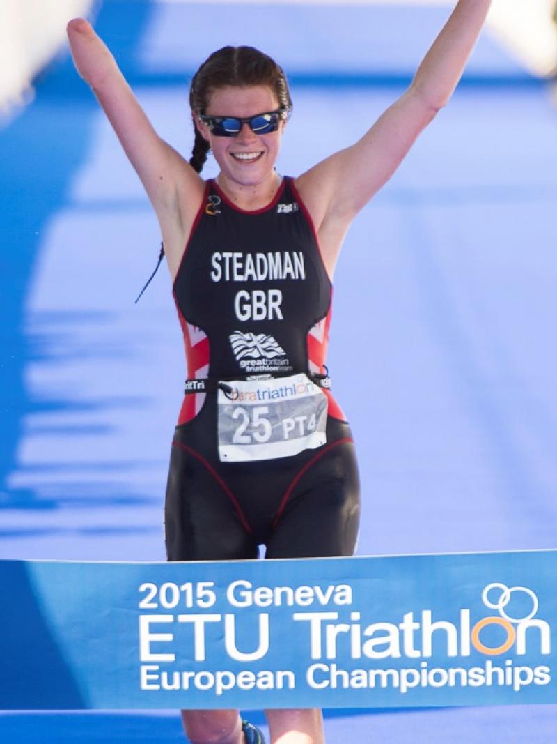 Woman crossing a finish line, celebrating