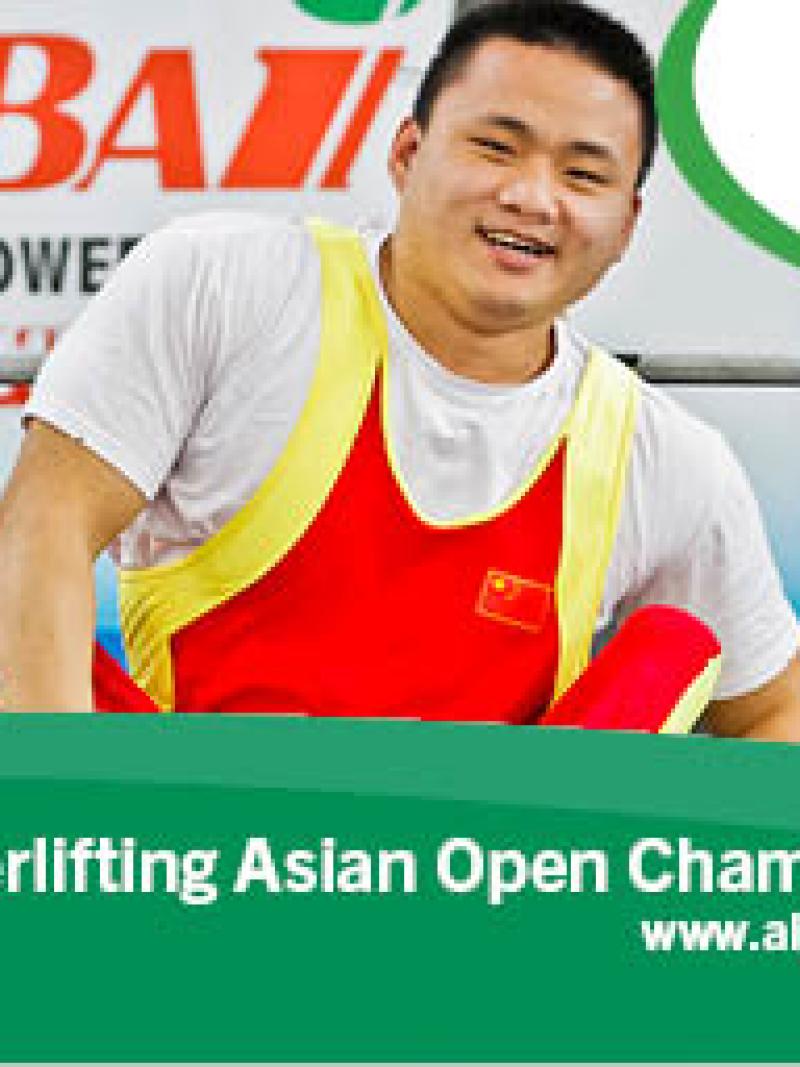 Chinese powerlifter on the bench, smiling