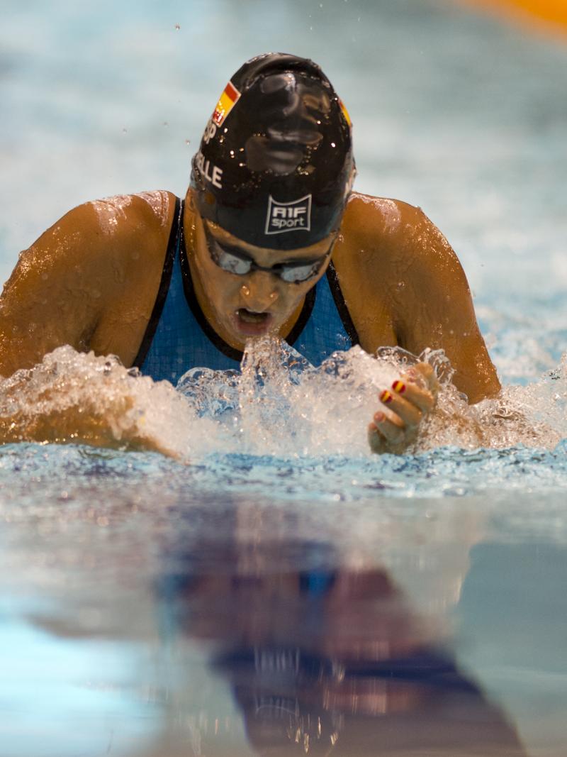 A swimmer competes in the breaststroke
