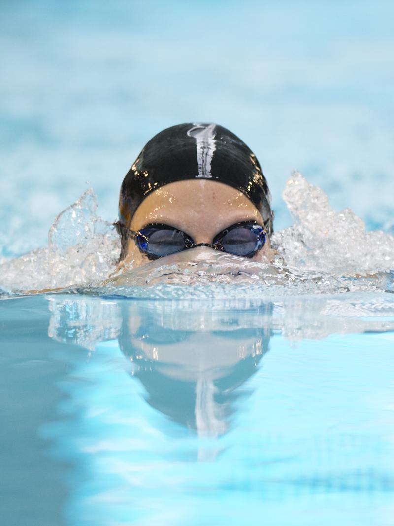 A swimmer's head rising out of the water
