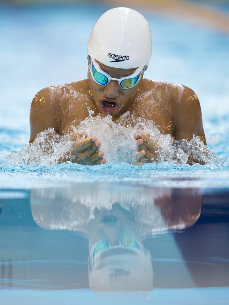 Swimmer in the water, doing breaststroke