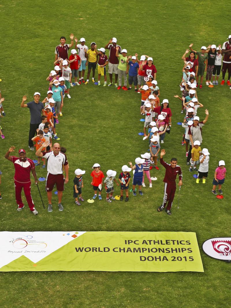 Group of people forming a 100, shot taken from above