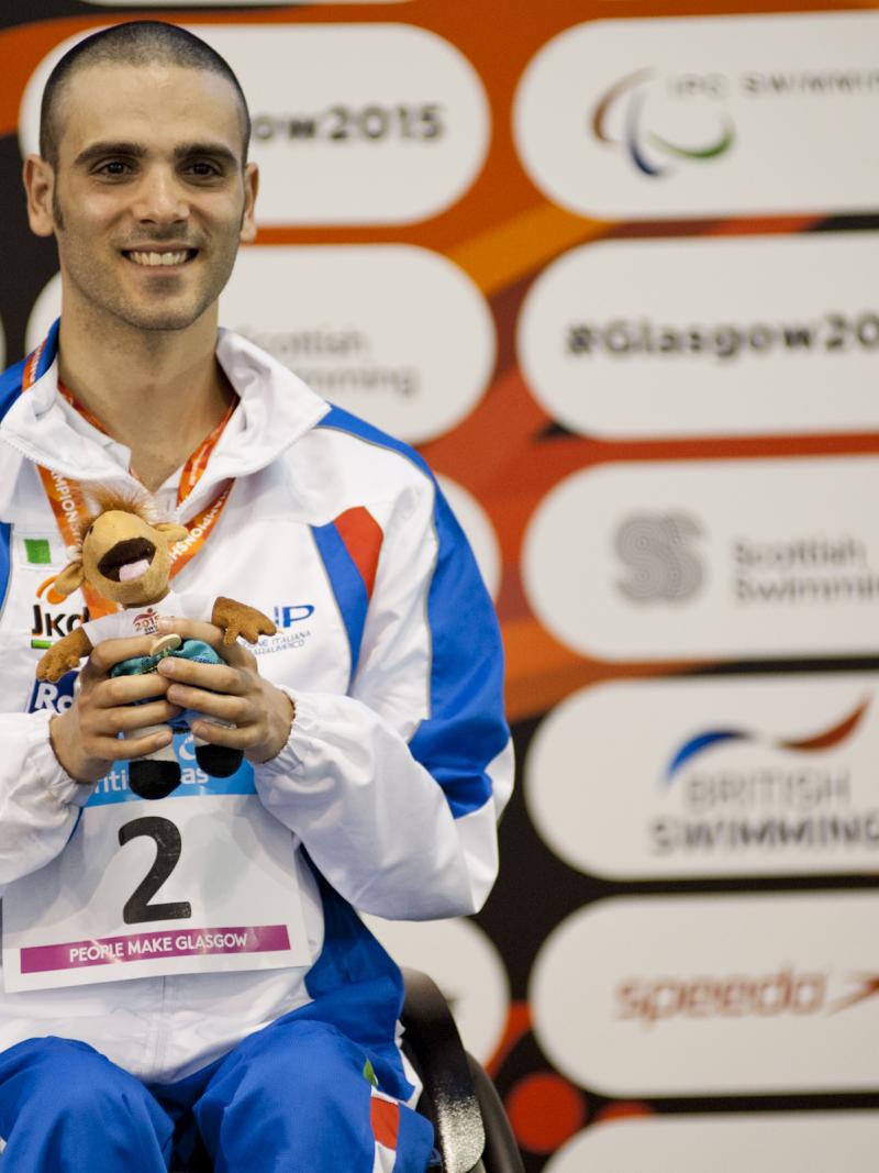 Vincenzo Boni of Italy on the podium after the Men's 50m Backstroke S3 at the 2015 IPC Swimming World Championships in Glasgow.