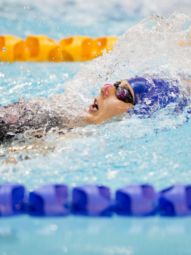Swimmer doing backstroke in the water