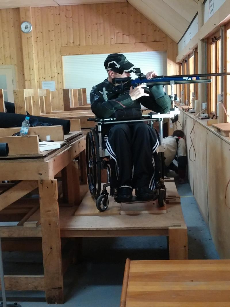 Man in wheelchair in a shooting range