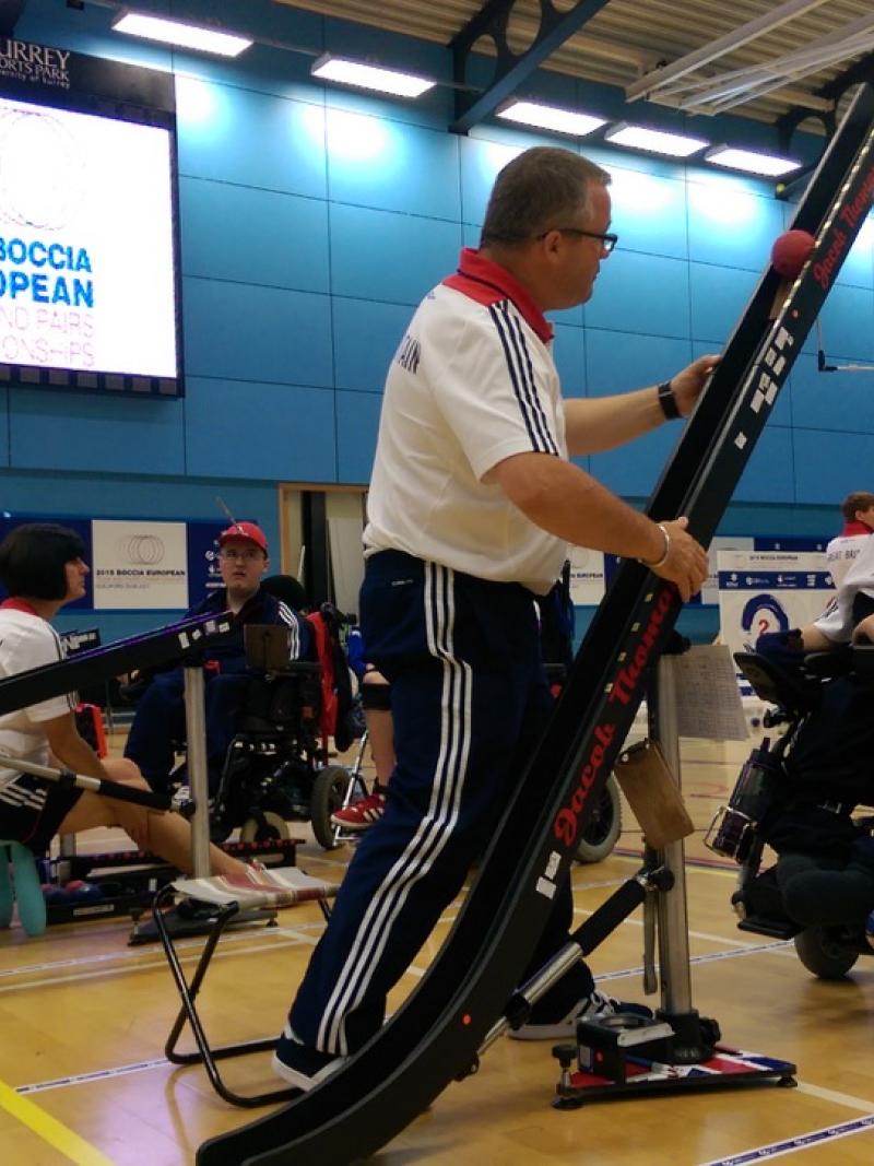 Man in electric wheelchair on a boccia field of play