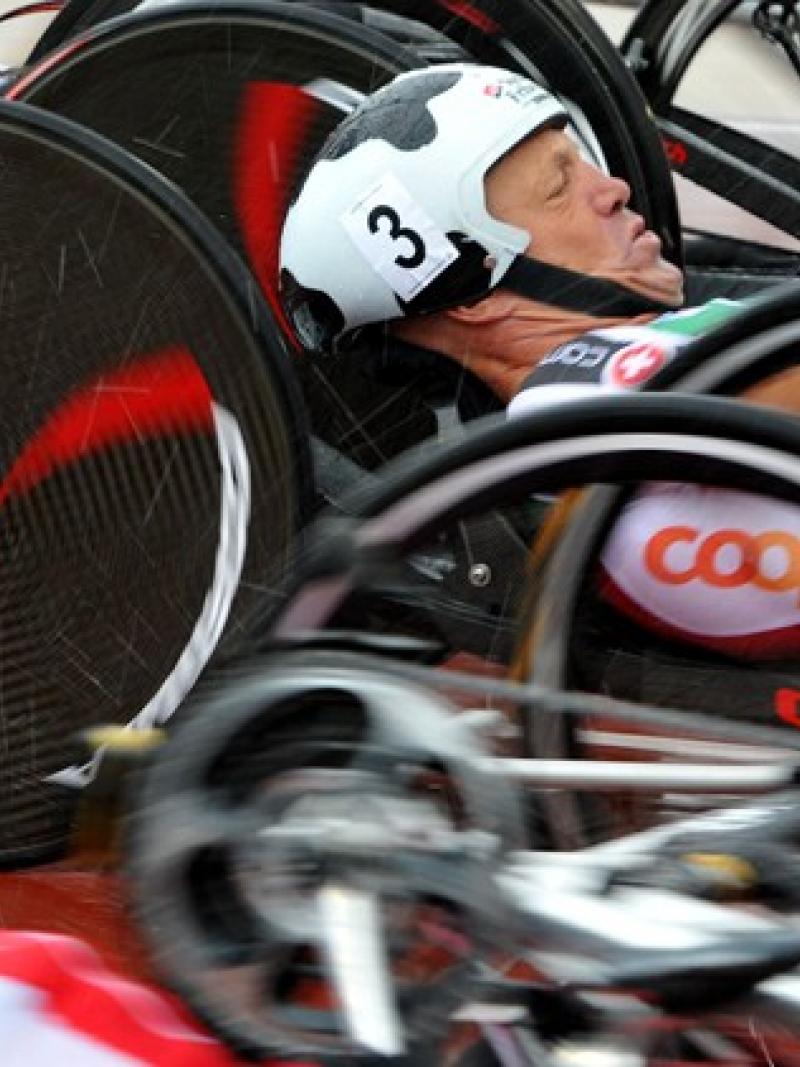 Several hand cyclists at the start of a race