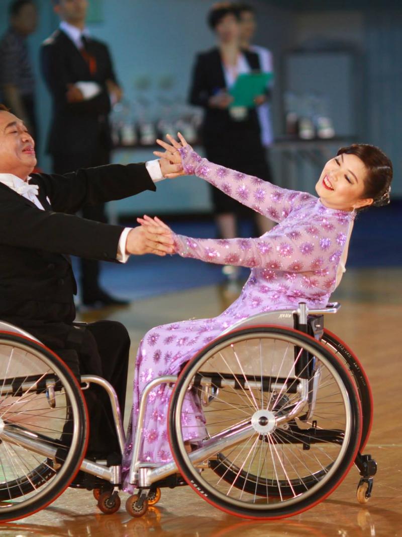 Wheelchair dancer partners competing in an event