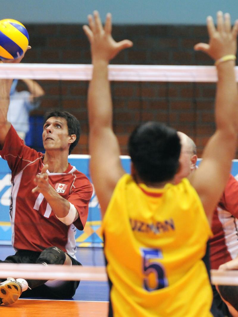 Athlete hits a volleyball.