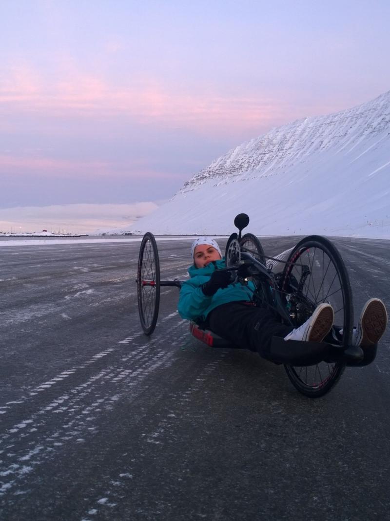 Handcyclist in front of an iced mountain