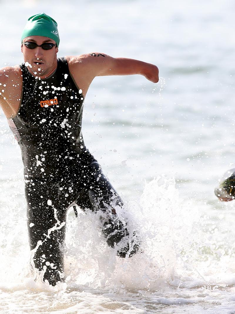 Martin Schulz of Germany emerges from the water in the swim portion of the men's PT4 class during the Aquece Rio Paratriathlon at Copacabana beach.