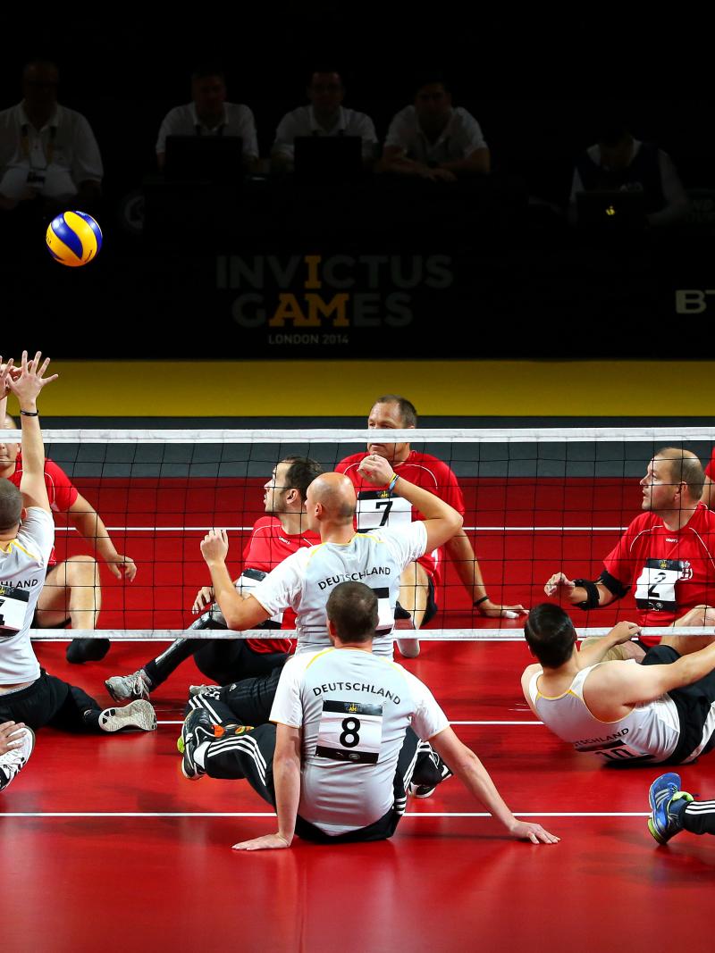 Michael Frenzke of Germany competes in the Sitting Volleyball 5th/6th Place Playoff between Denmark and Germany at the Copper Box Arena on day four of the Invictus Games.