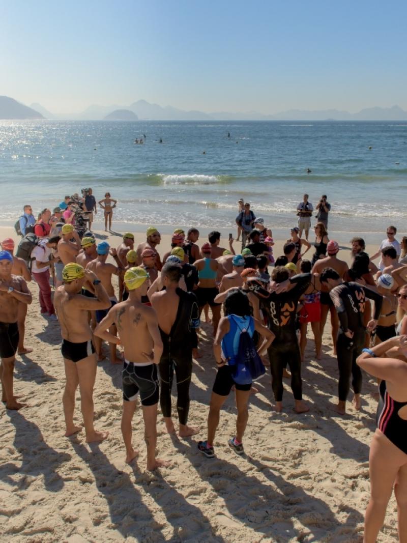 Group of athletes on the beach, duscussing