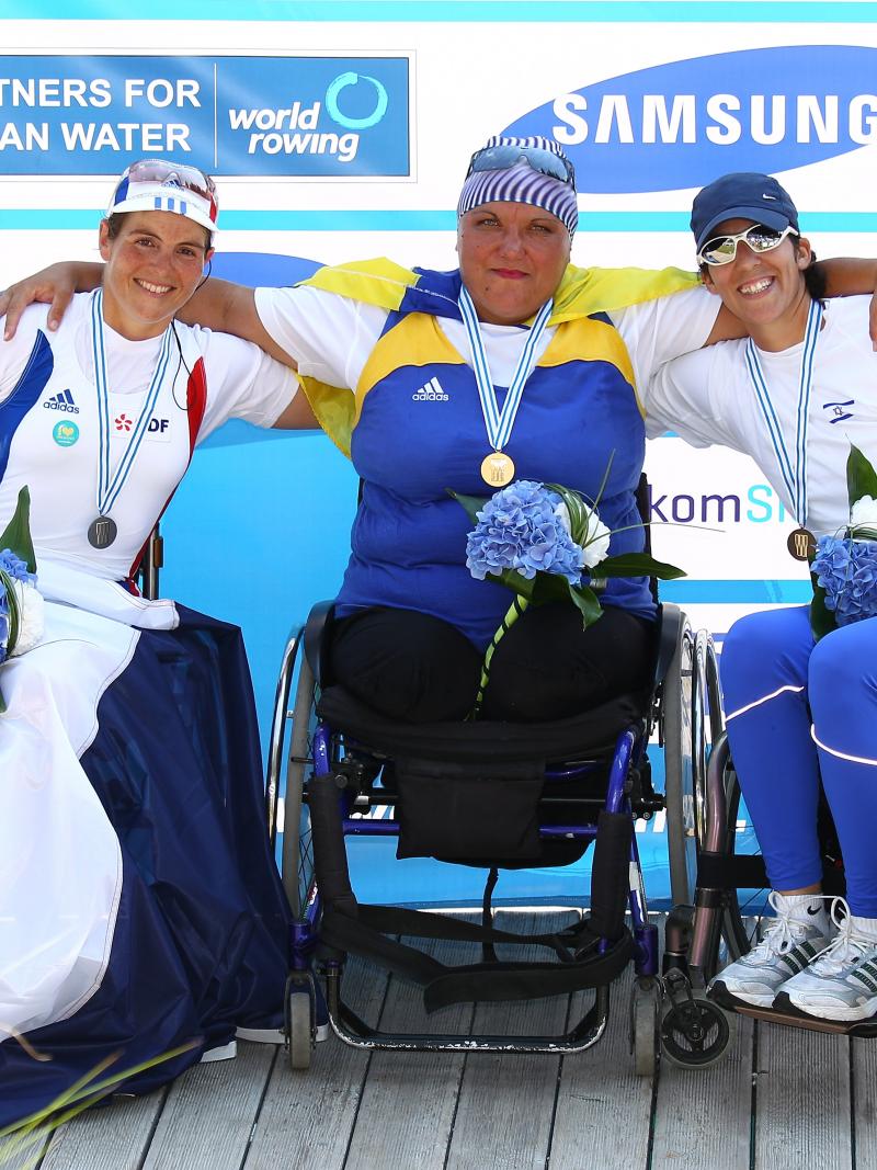 Three women smiling.