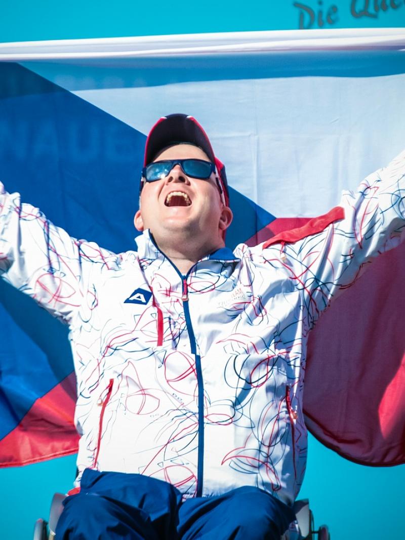 Archer raises flag