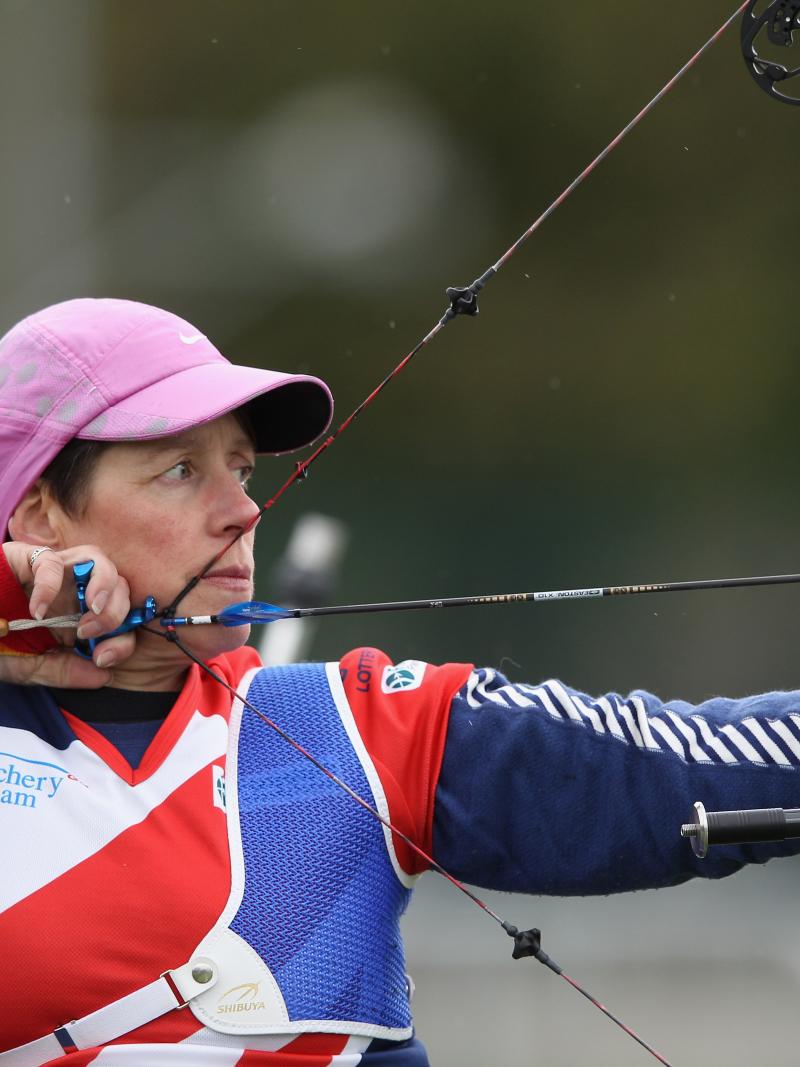 Female archer competing