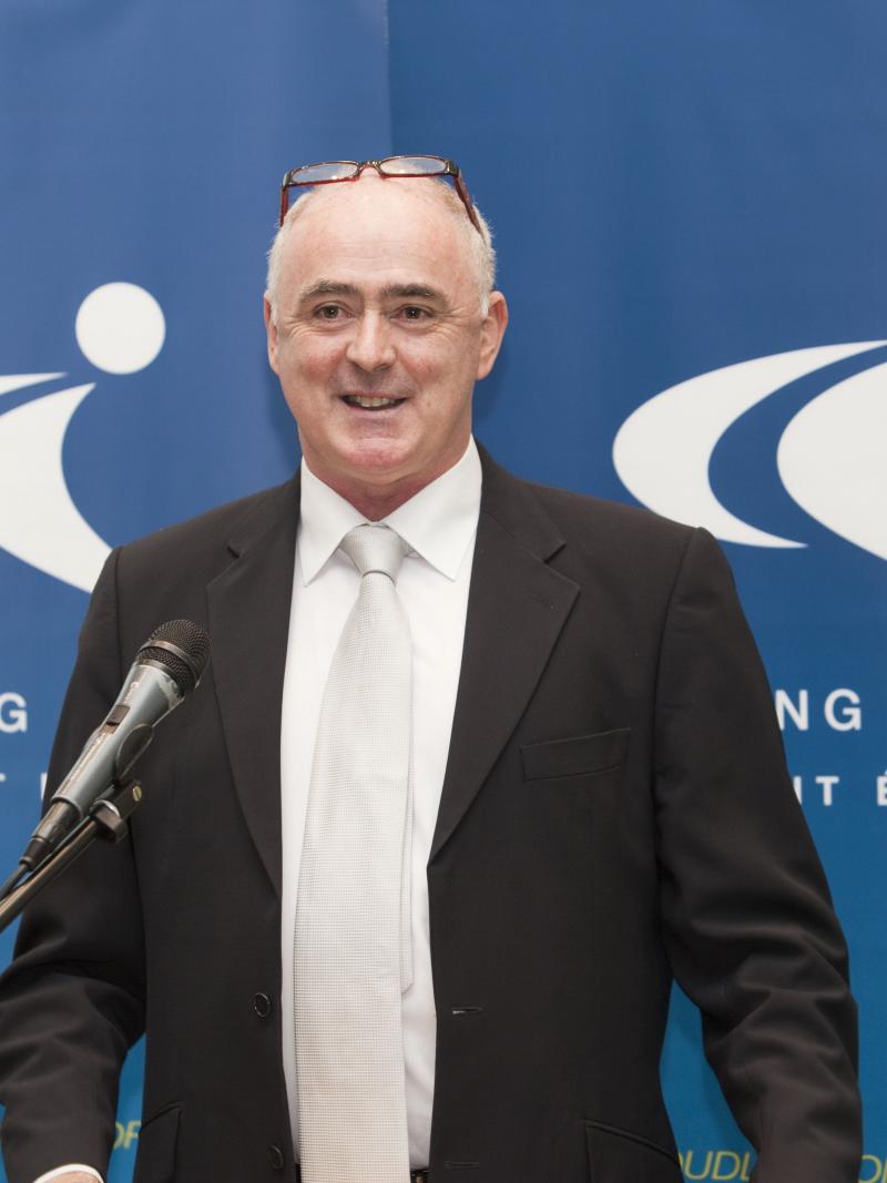 Upper body of man who is giving a speech