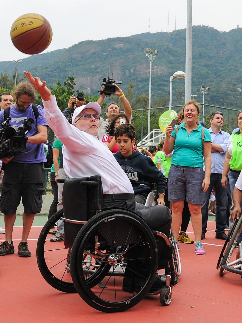 IPC president Sir Philip, a five-time Paralympian in wheelchair basketball, shows them how it's done.