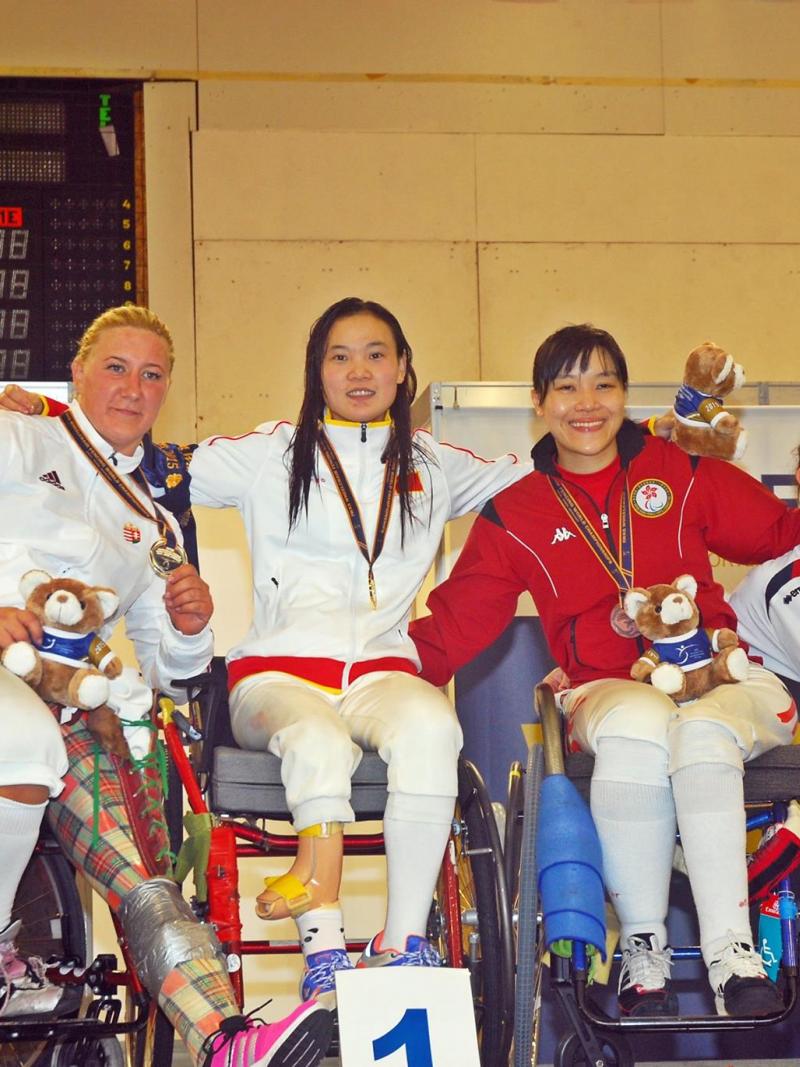 Four athletes at the medal ceremony.