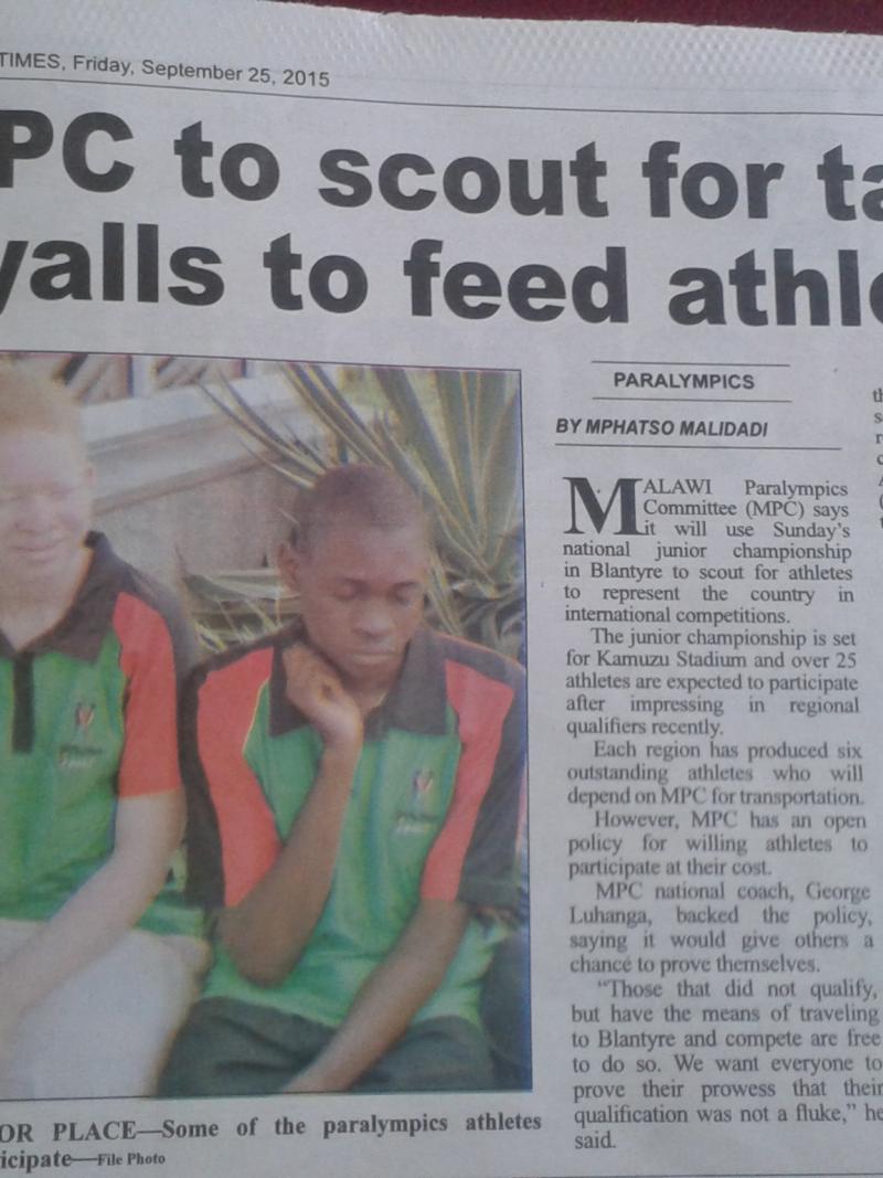 Newspaper article with photo showing two young boys