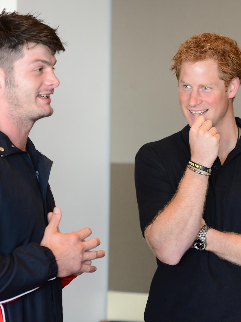British sprinter Dave Henson meets Prince Harry at the 2014 Invictus Games.