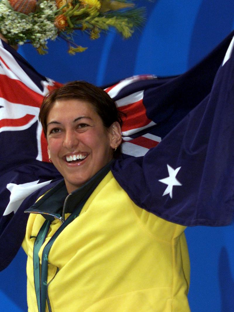 An Australian swimmer celebrates winning a gold medal at the Sydney 2000 Paralympic Games.