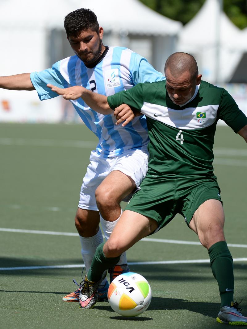 Rodrigo Luquez of Argentina and Jose Monteiro Guimaraes of Brazil in the football 7-a-side gold medal game at the Toronto 2015 Parapan American Games.
