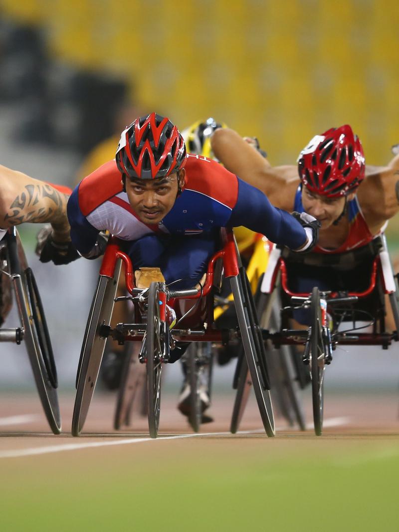 Field of wheelchair racers on track
