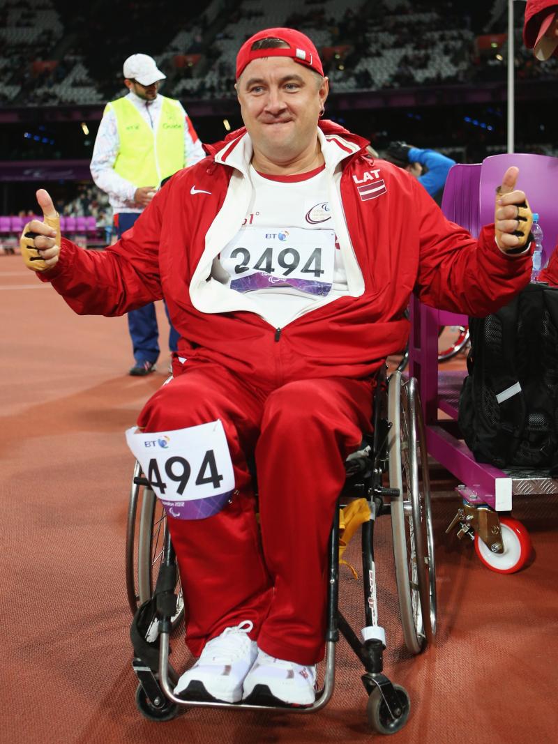 Man in wheelchair showing thumbs up