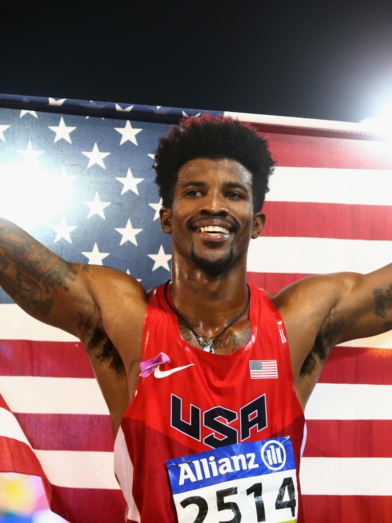 Man holding up an American flag