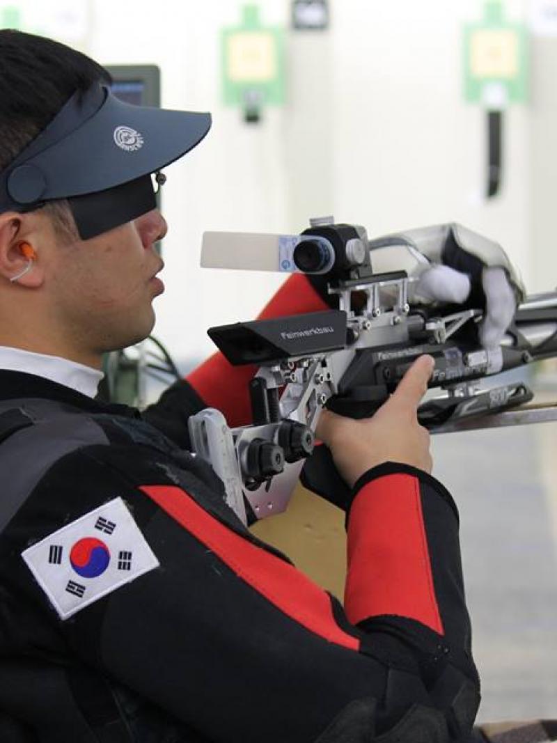 A shooter calms himself during a match