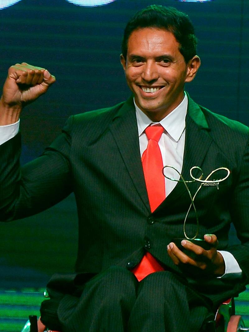 Luis Carlos Cardoso da Silva poses with his trophy won in the Paracanoe category of the Brazil Paralympics 2014 Awards Ceremony.