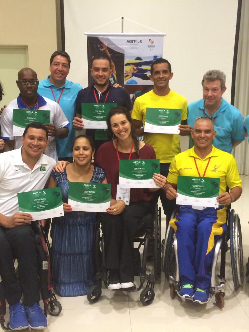 Paralympians show-off their certificates after being trained to be leaders in the Paralympic Movement
