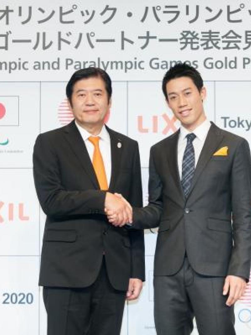 Two men shaking hands after sponsorship deal