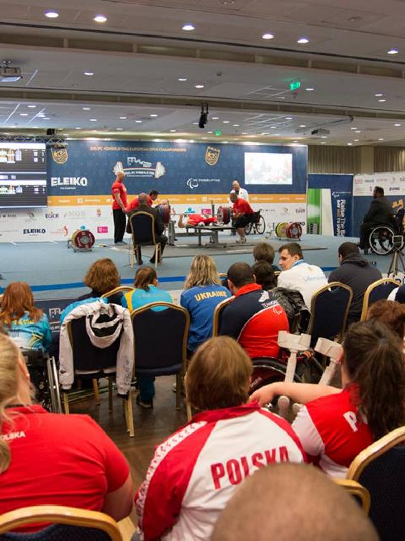 The crowd watches on as a powerlifter attempt a lift