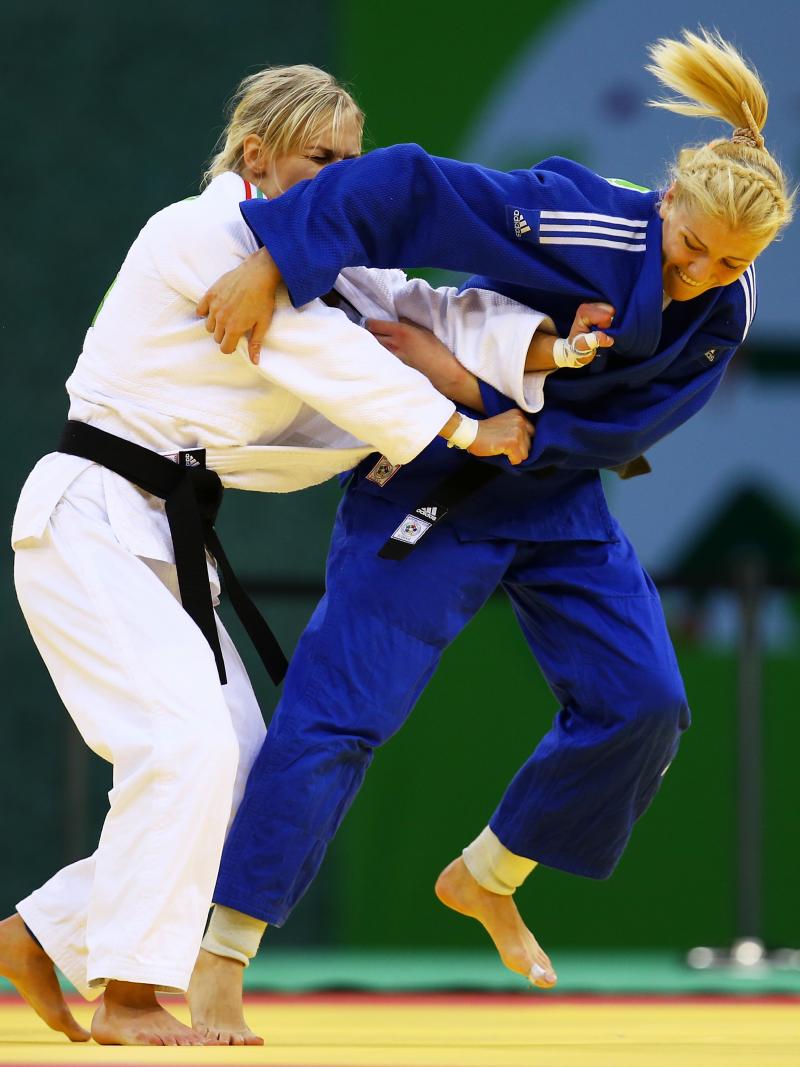 Maryna Cherniak of Ukraine (blue) and Eva Cseroviczki of Hungary (white) compete during the Women's Judo -48kg bronze medal match on day thirteen of the Baku 2015 European Games.
