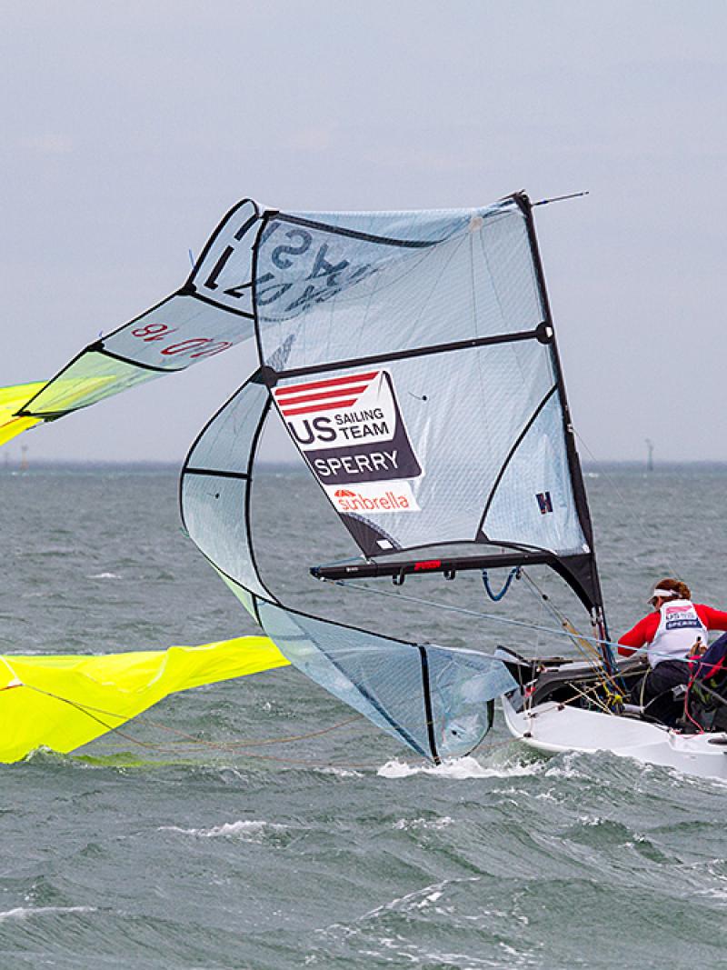 Boat on the water with a broken mast