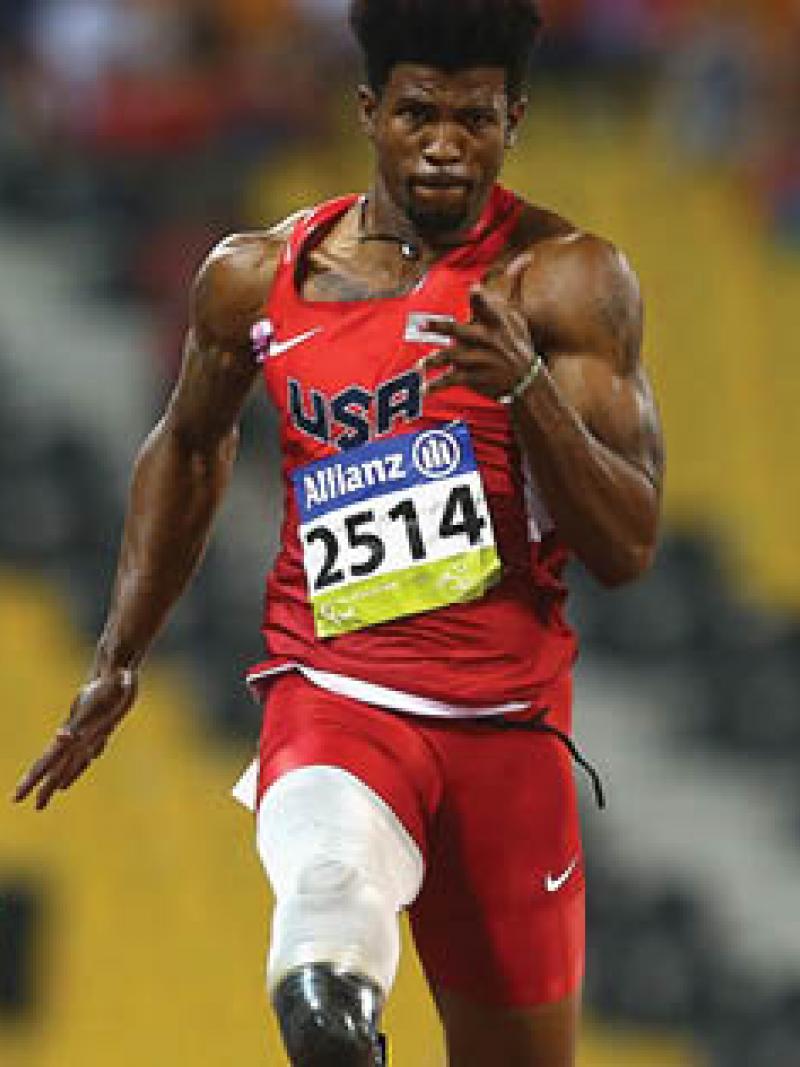 Graphic with a stamp showing a 24 and a picture of a sprinter